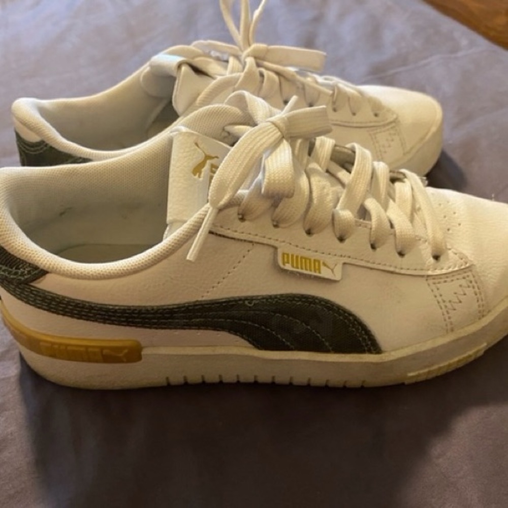 Puma White Sneakers with Gold and Black Accents